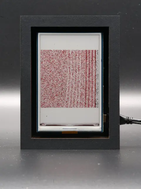 The object from the front. The image is red, with some faint white lines. On the right side there are some dark grey lines.