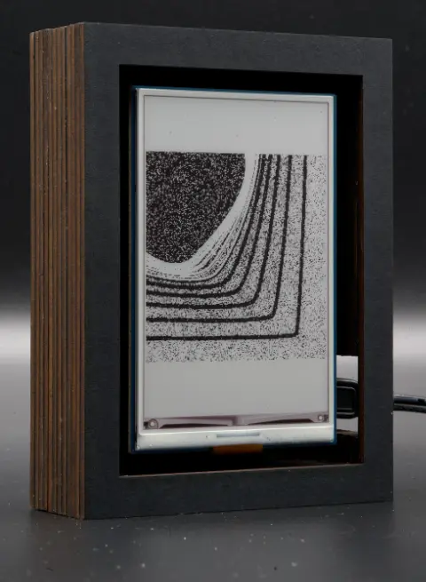 The object, showing black lines that slowly turn into white lines, that slowly morph into a very dark blob in the top left corner.