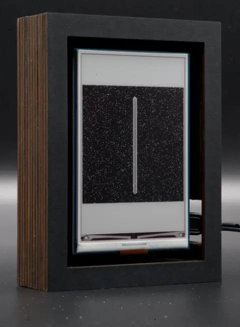 The object, showing a very thin, high, light rectangle, on a very dark background.