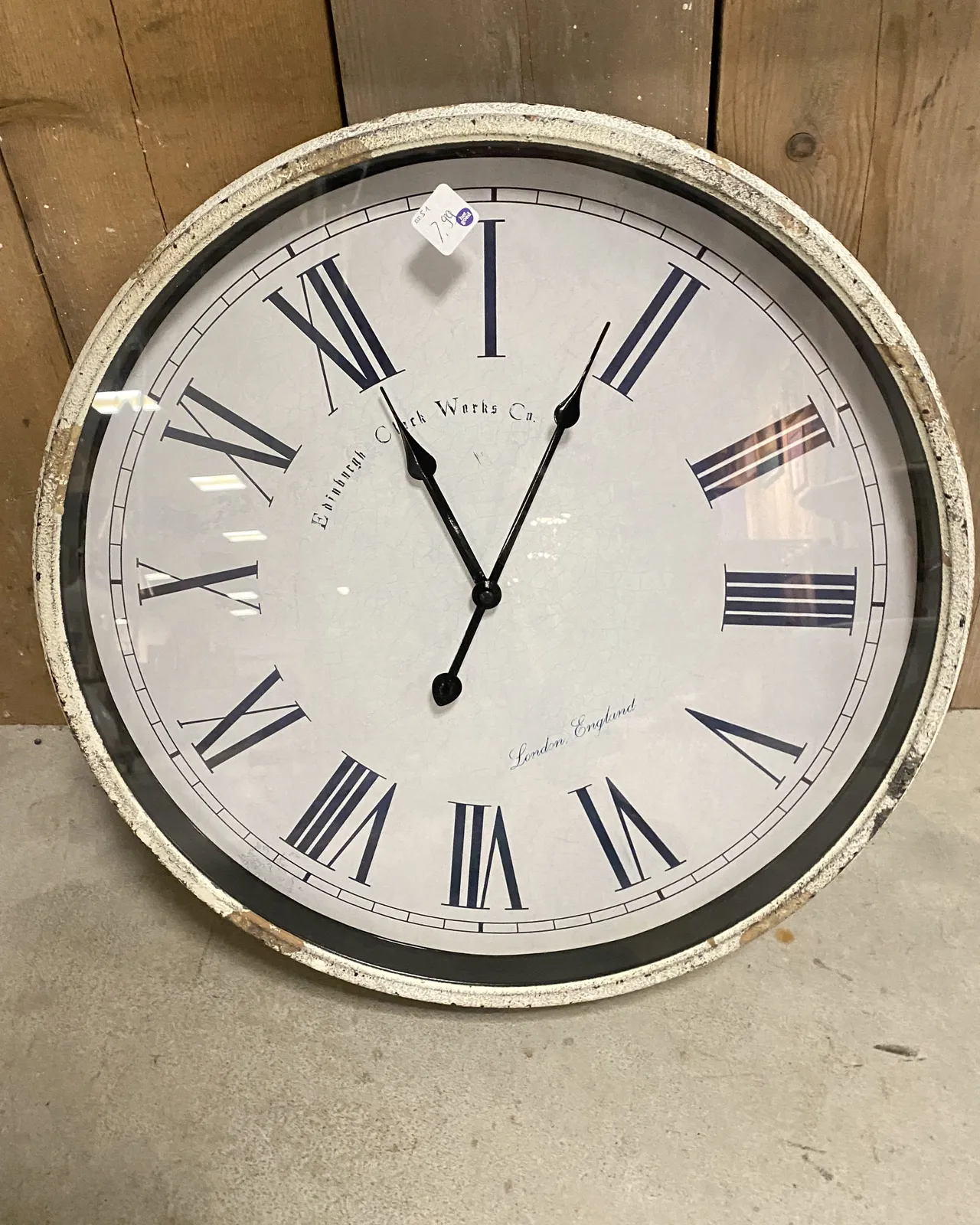The clock is placed slanted so it is rather confusing. You might think that it points at 3 minutes past 11. But when you pay a little attention you can see that in fact it is 8 minutes past 12.