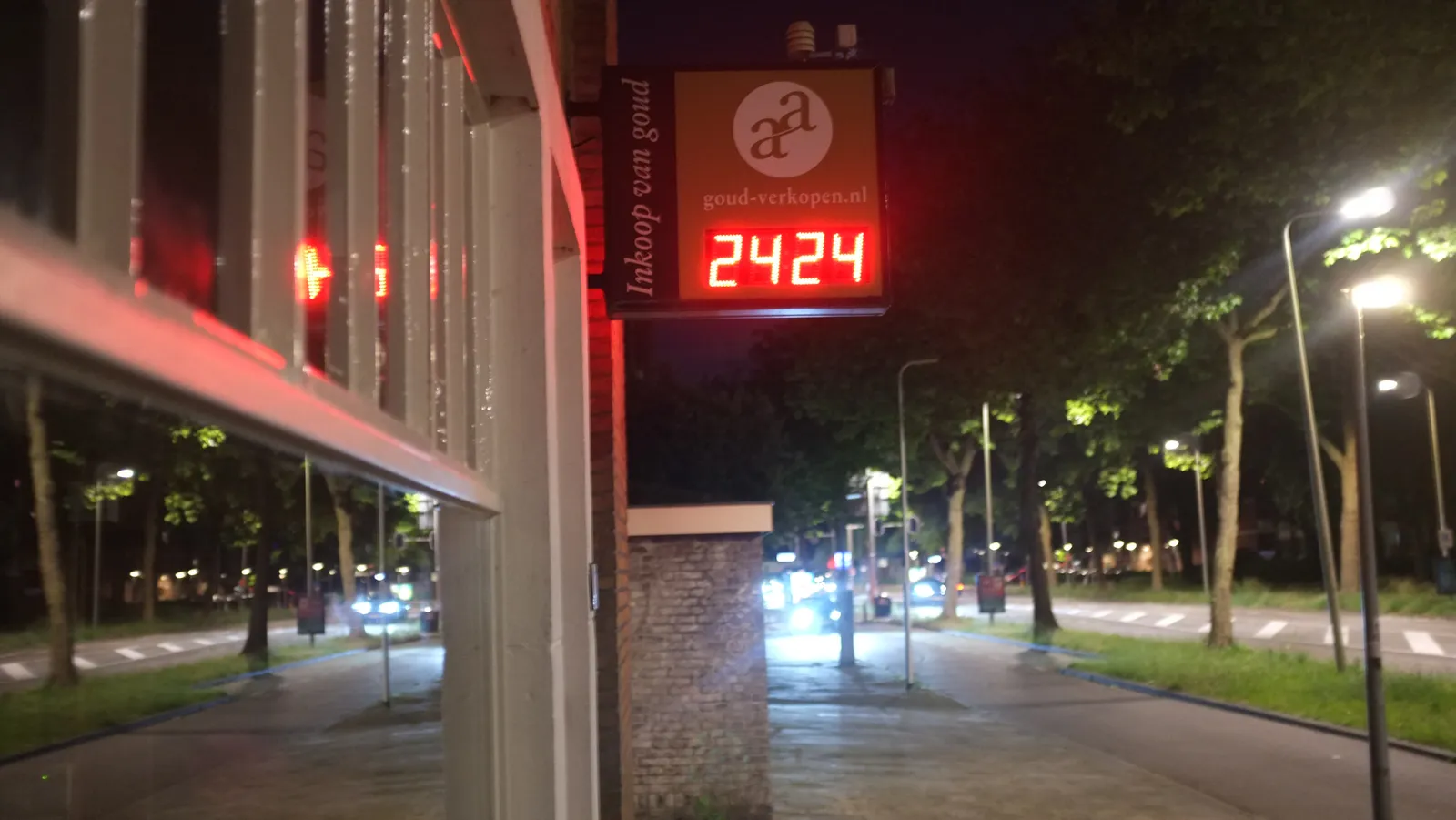 There’s a digital clock in this sign attached to a building. You can sell your gold here. The clock says it is 24 24.