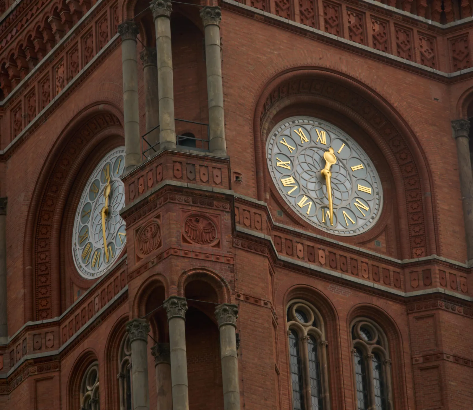 A large clock on a large monumental building. It points at approximately half past 12.