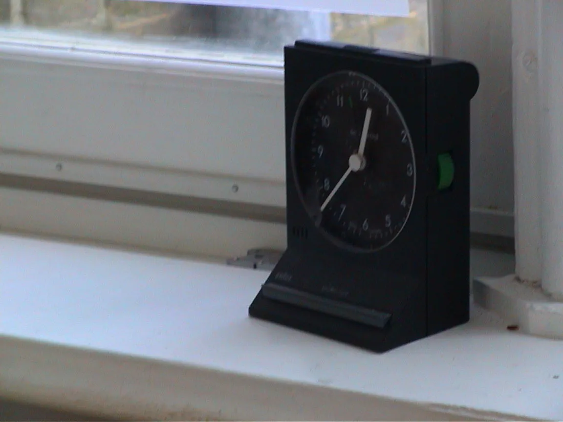 This small black clock points at 12:37