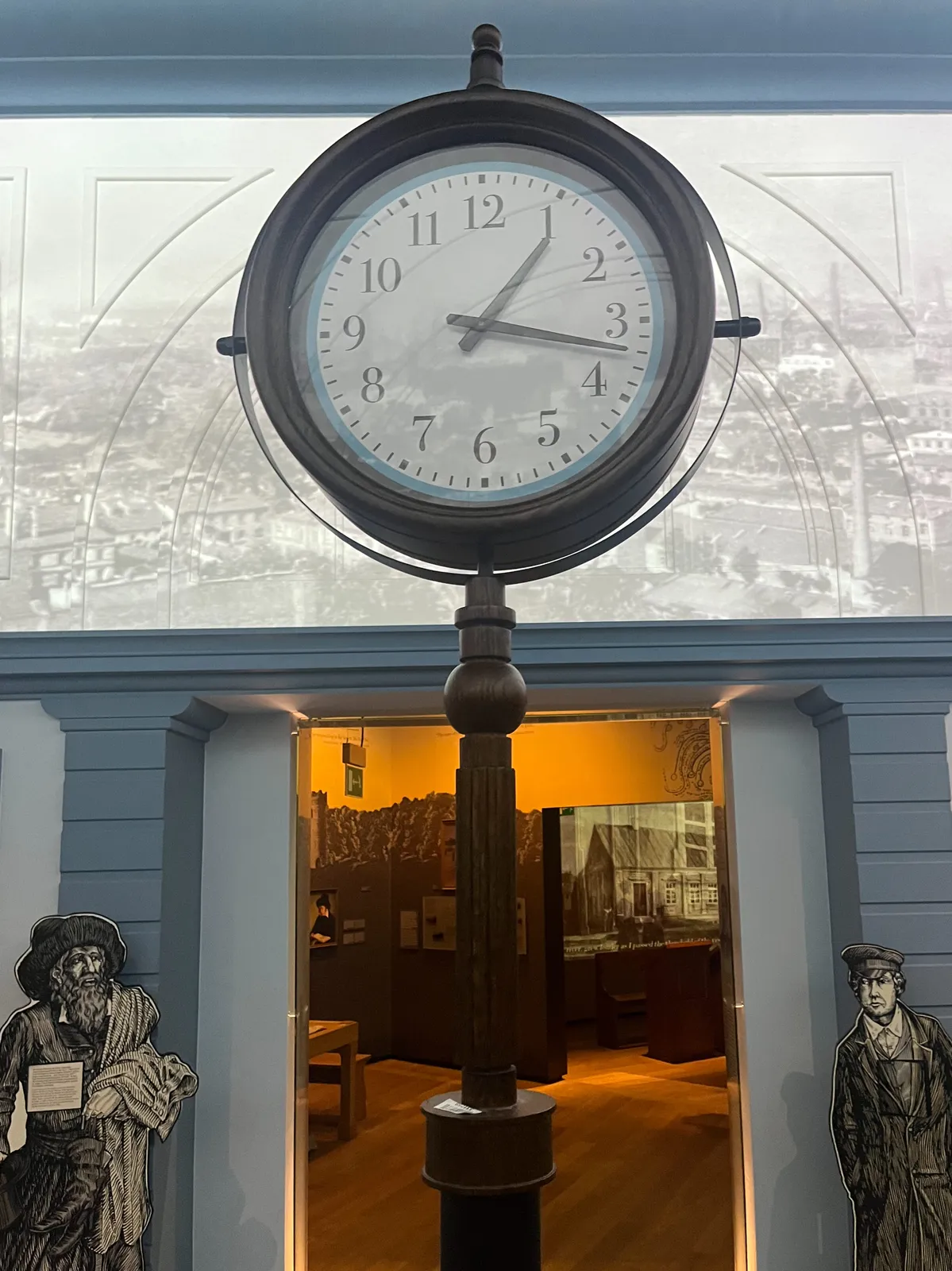 An old station clock in a museum. It points at 17 minutes past one. 
