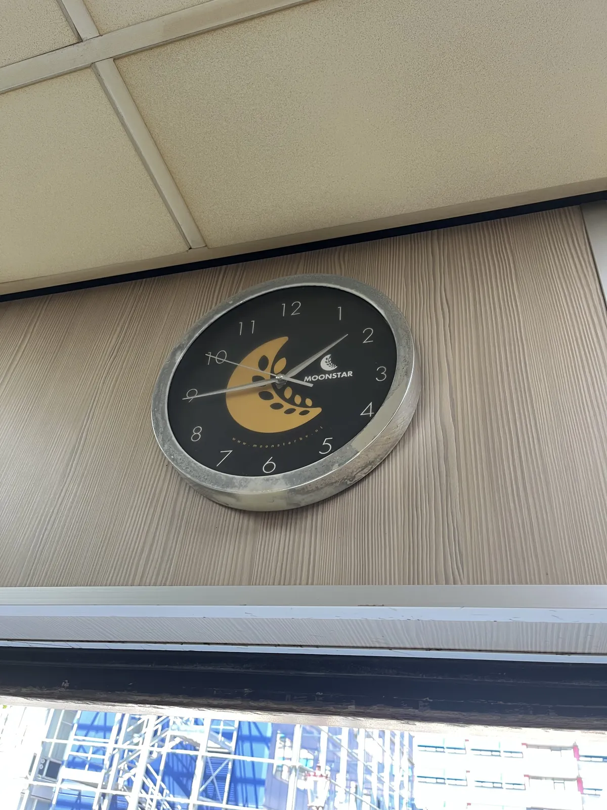 A clock points at 16 minutes to 2.