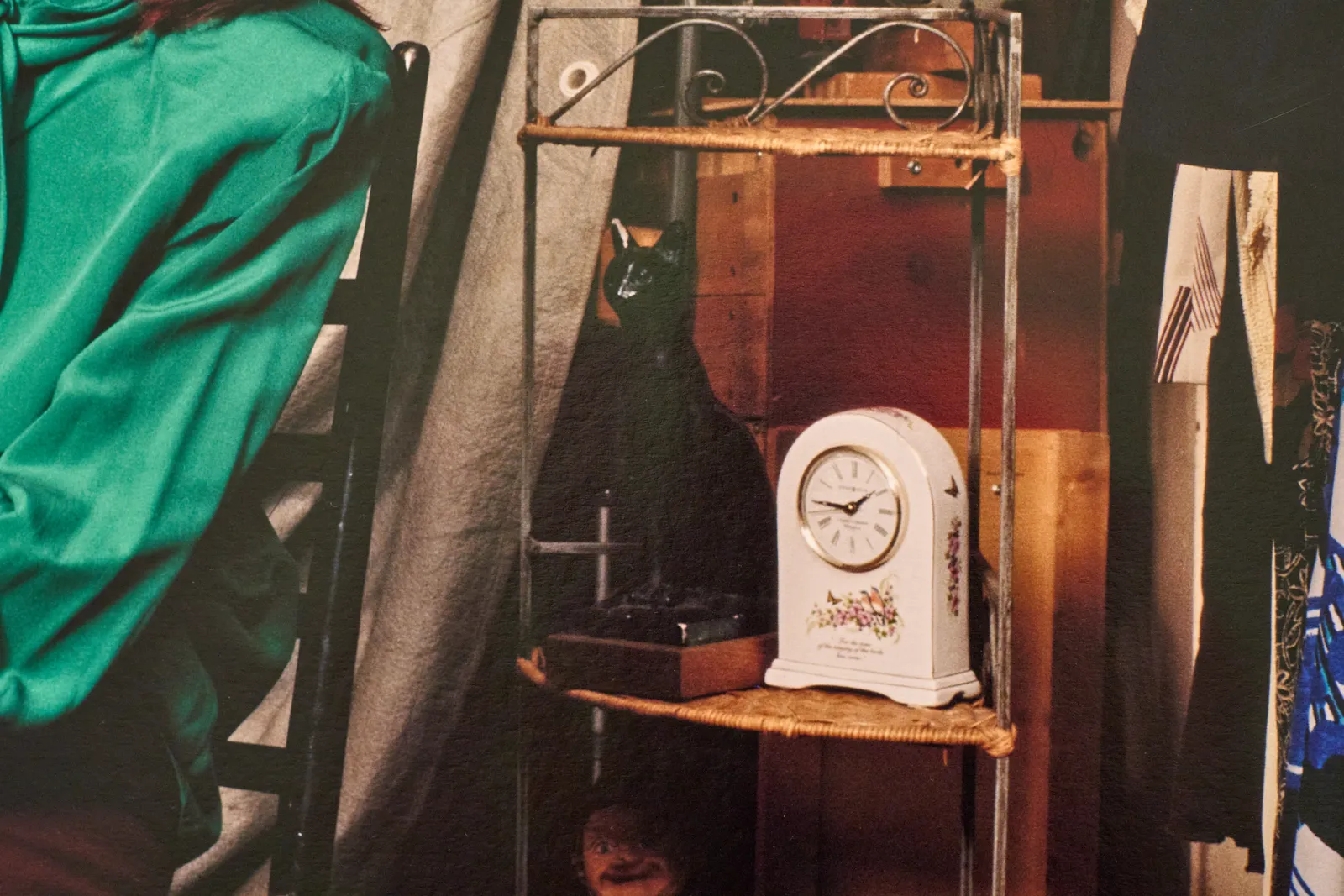 A picture taken from a detail of a colour photograph. There a clock in this scene which points at 14 minutes to two.