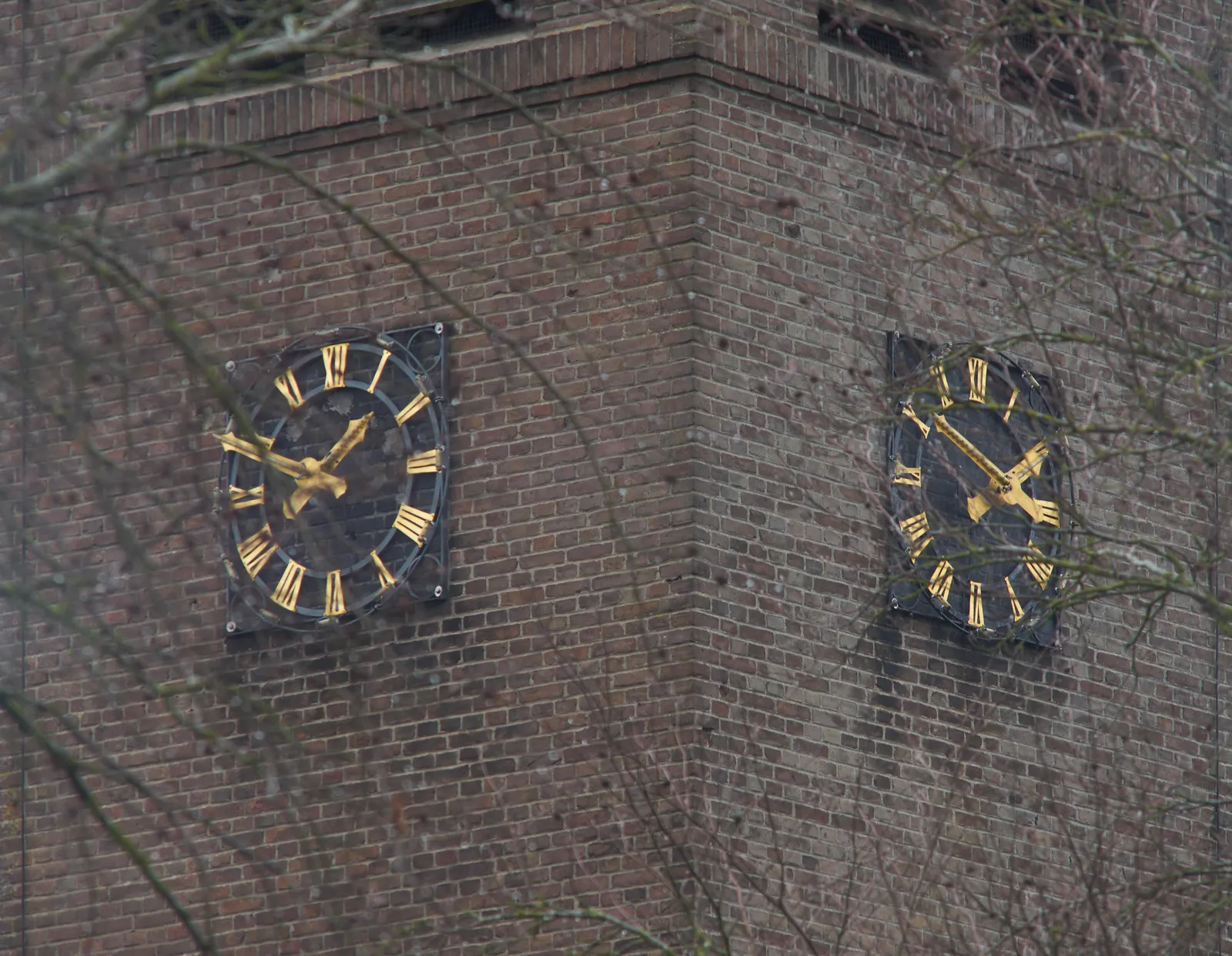There are two church clocks on this image. The one on the right says it is nine minutes to one, which it is right now. The one on the right pointed at the right time a minute ago.