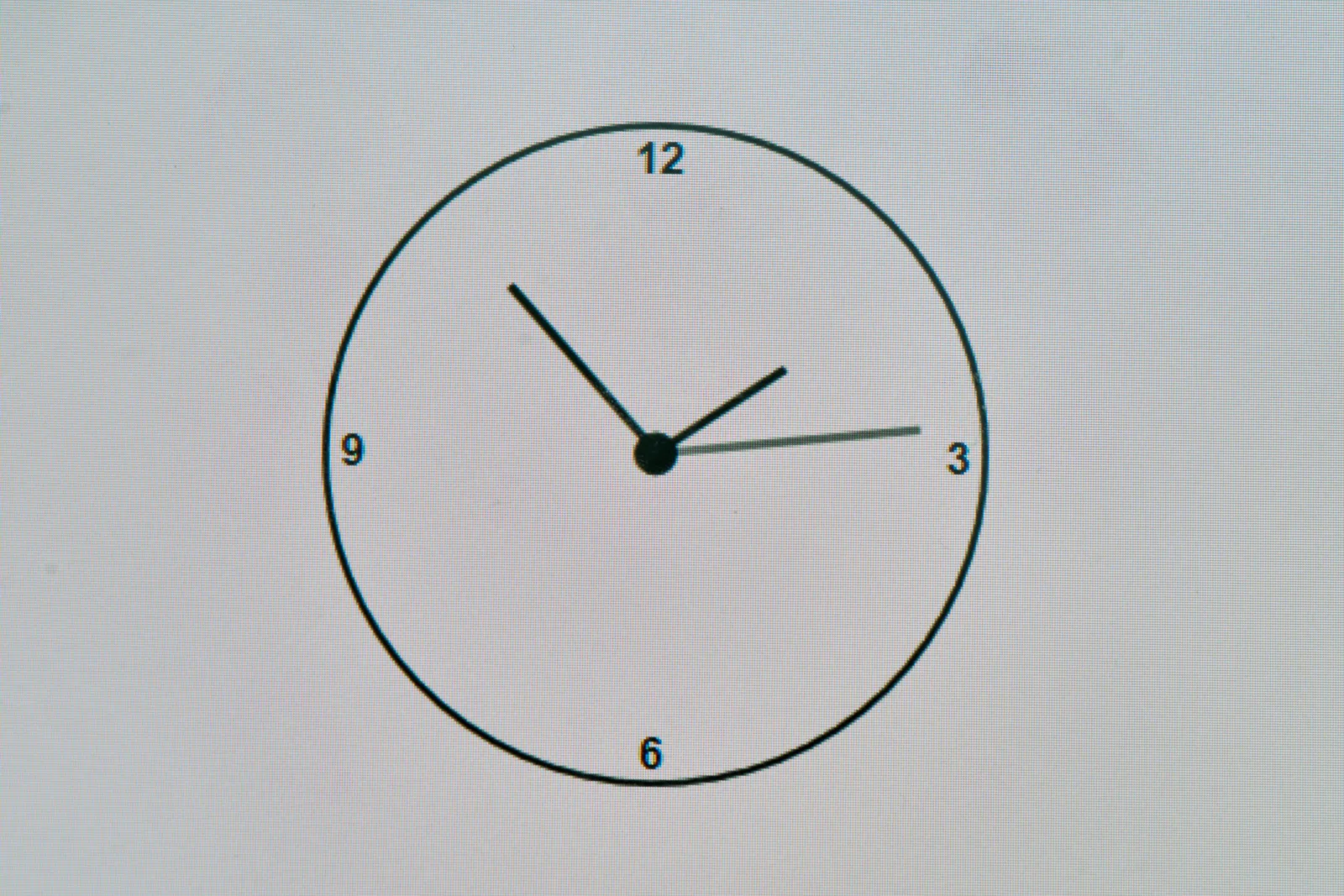 A black analogue clock on a white digital screen. It points at 7 minutes to 2.
