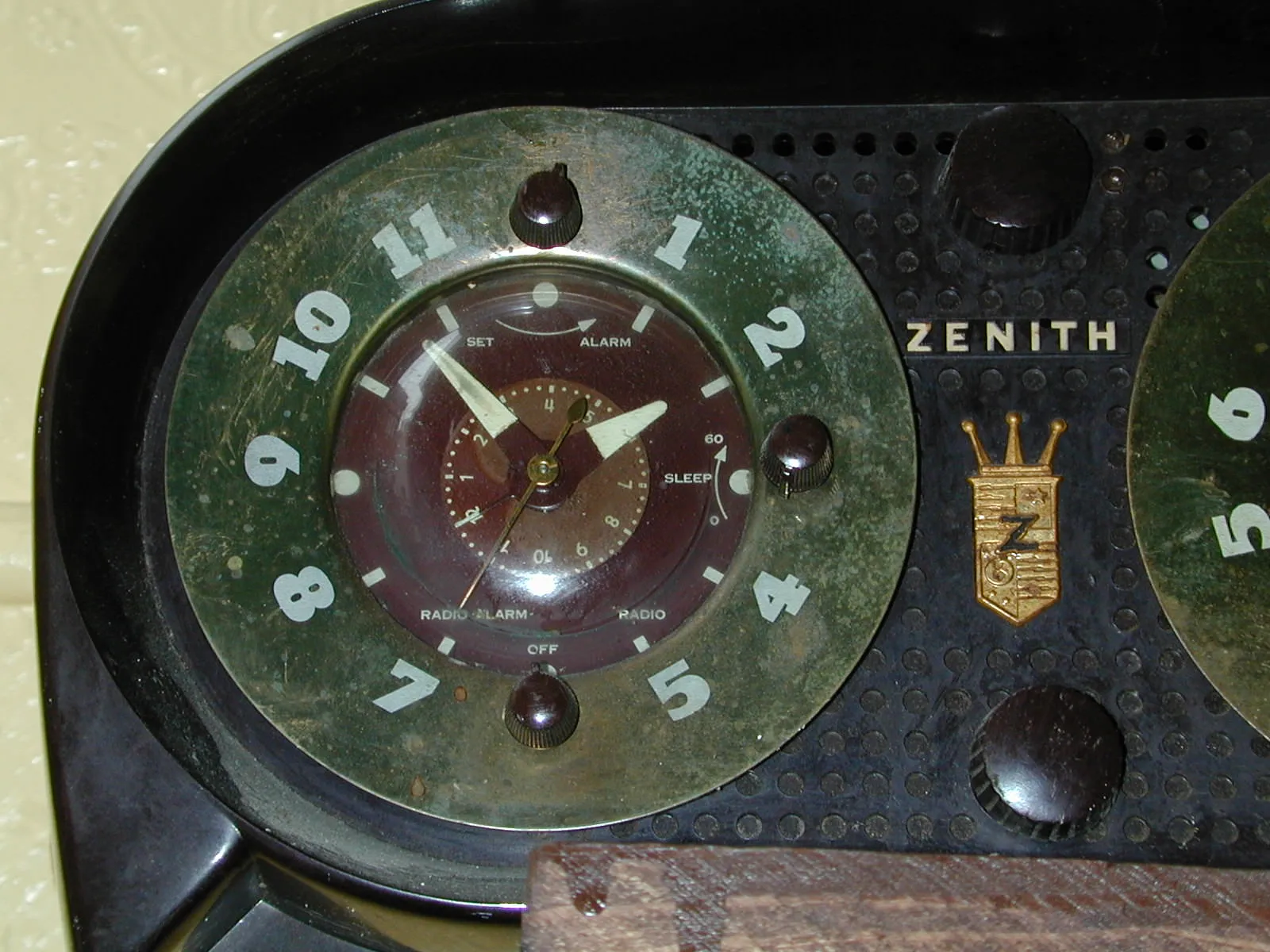 A clock points at six minutes to two.