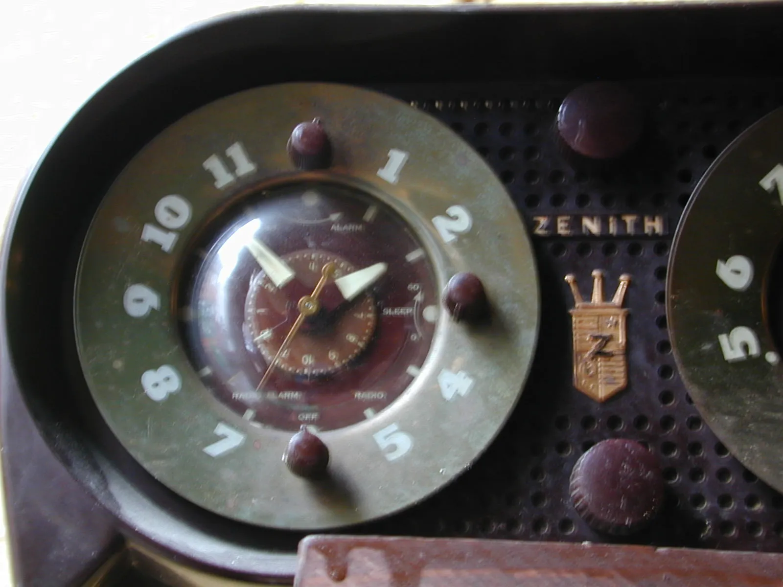 A clock points at six minutes to two.