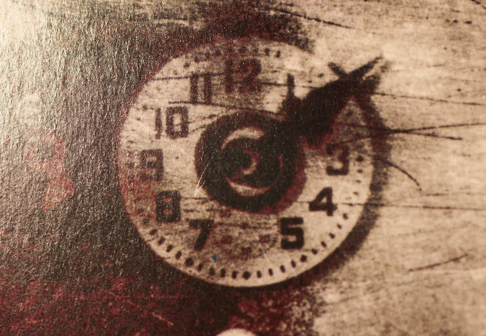 A detail from a Ministry long play record. A clock can be seen that points at 10 past 2.