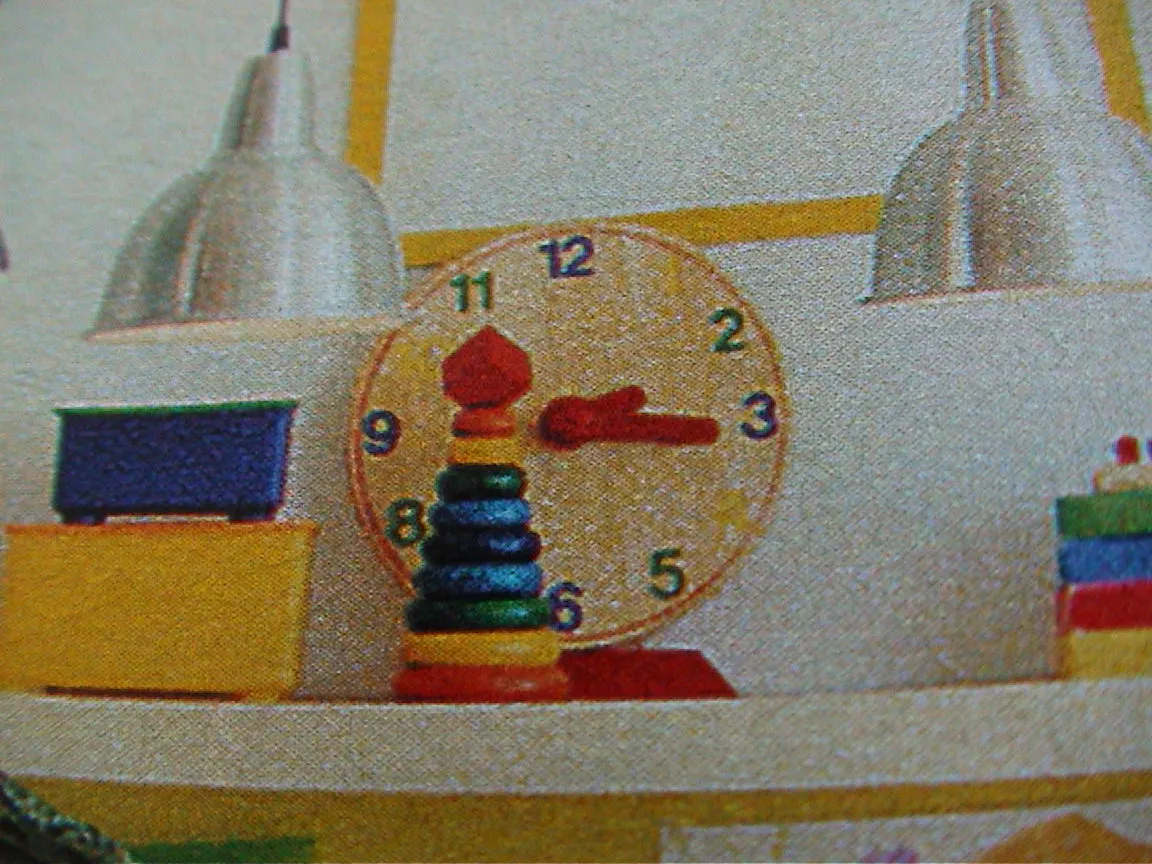 A clock that seems to be printed in a magazine says it is a quarter past two.