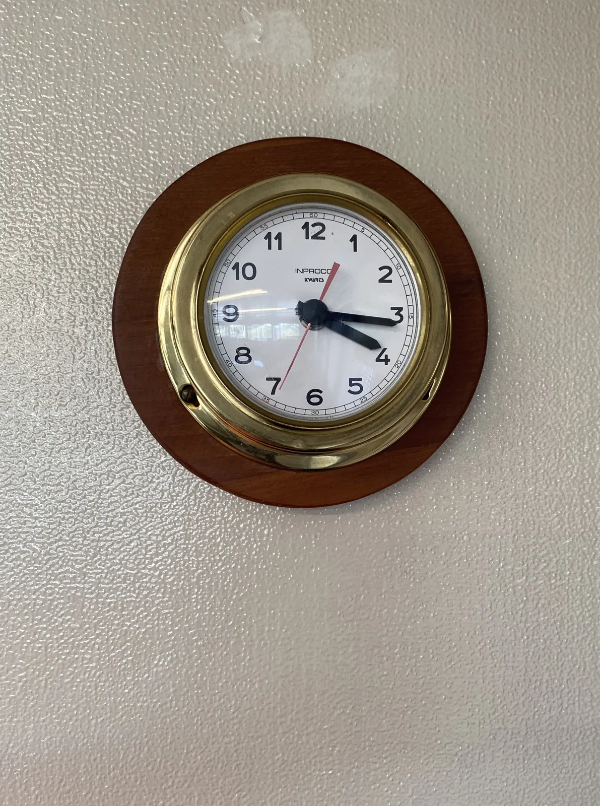 The hour hand points at approximately a quarter to four, but the minute hand points at 16 minutes past the hour. So, it is either 16 minutes past 3, or 16 minutes past 4.
