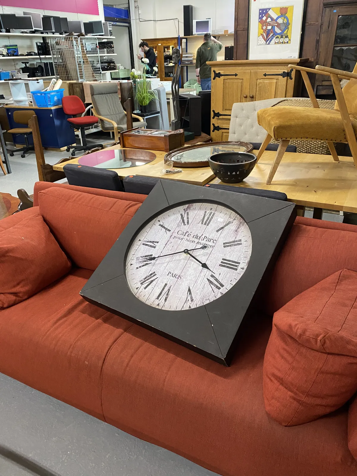 This clock makes me wonder why some things are designed and made. It looks like an old wooden clock, but it’s framed in a not so old frame. It points at 20 to 4.