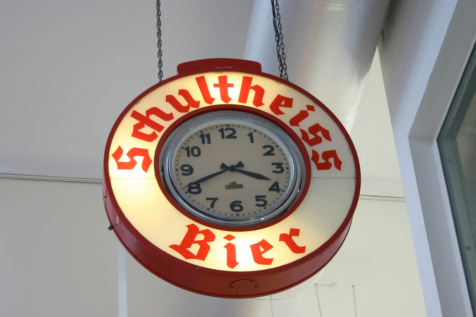 An advertisement clock for Schultheiss Bier. It is 41 minutes past three, which probably means it is beer o'clock.