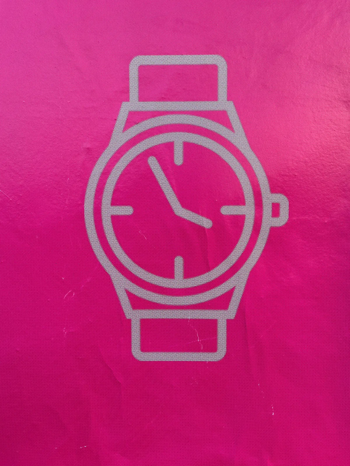 An icon of a watch, printed in white on magenta. It points at approximately 4 minutes to 4.
