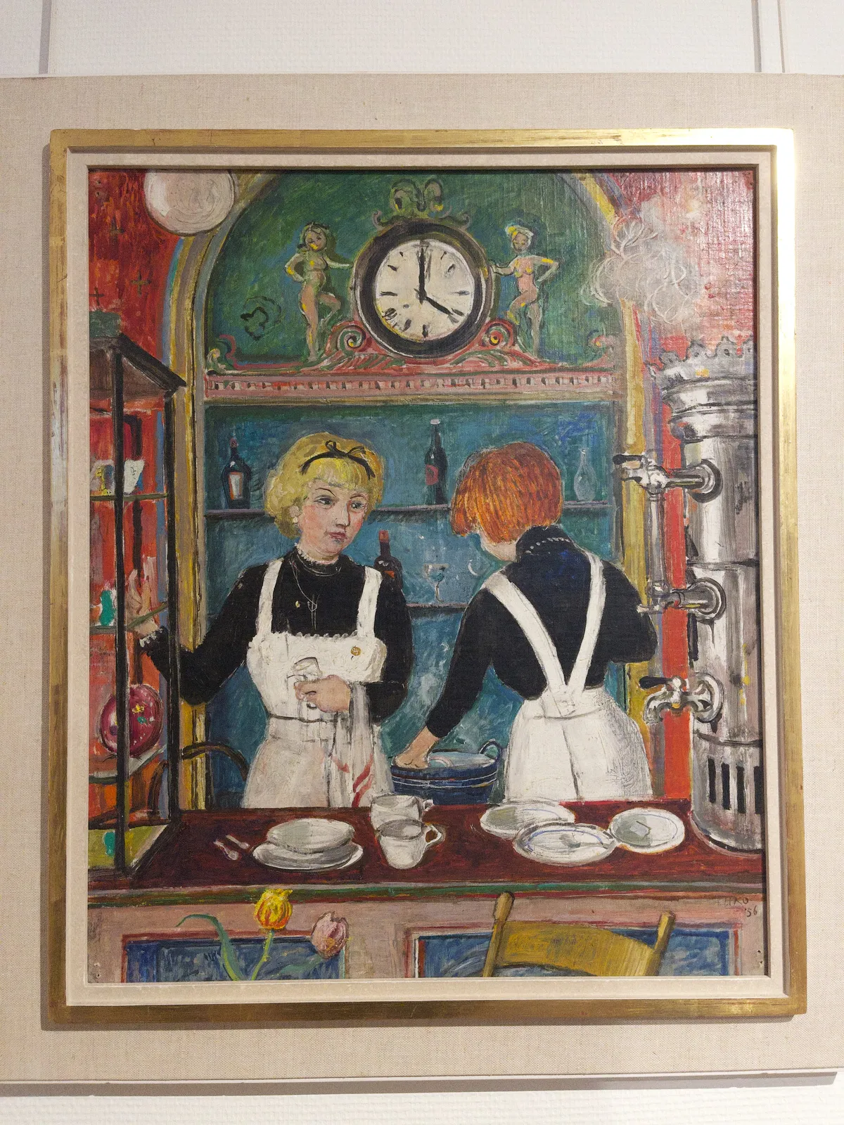 A painting of two women, behind the counter in a colourful cafe. There’s a clock behind them that points at four o’clock.