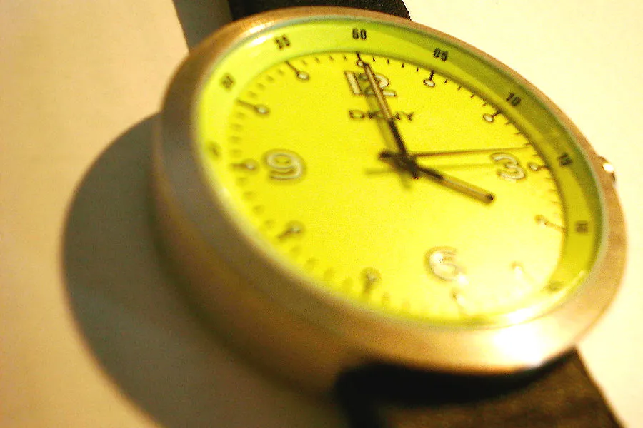 A watch points at four o’clock.
