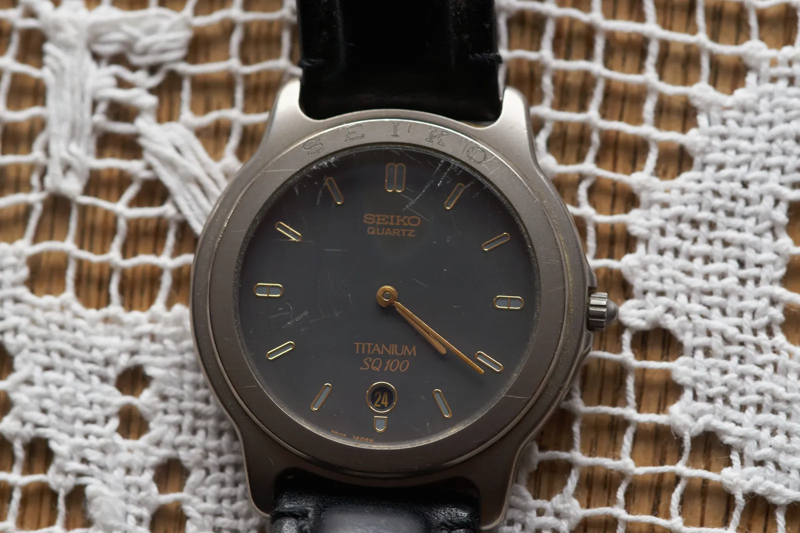 This watch points at 21 past 4. 