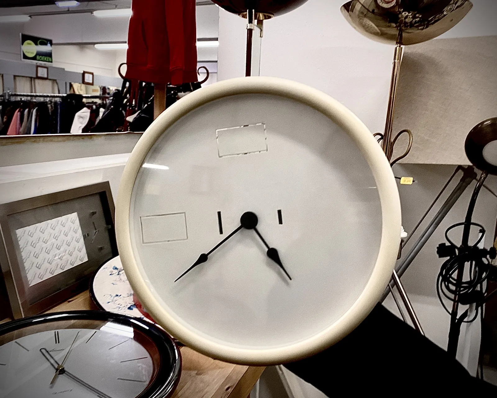 There’s more than one clock in this picture. The one that clearly has the most attention seems to point at approximately 22 minutes to five.