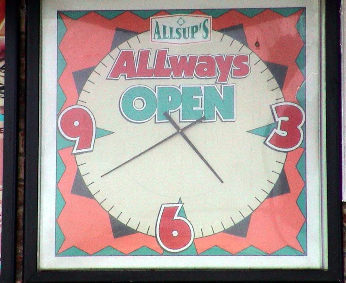 This playful Allsup’s Always Open clock points at twenty to five.