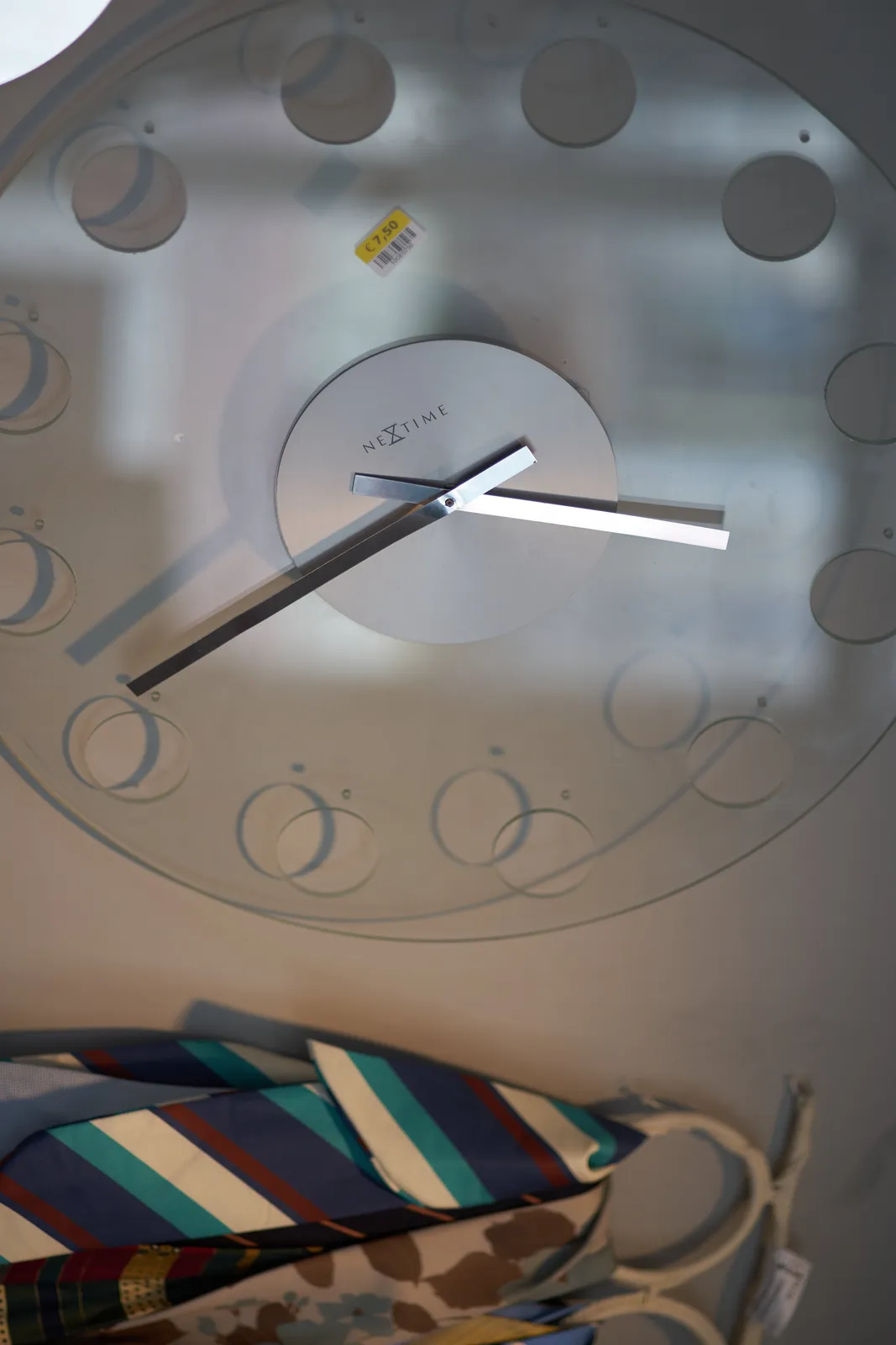This plastic transparent clock looks a bit skewed, so it’s hard to see what time it is. But after some deduction is seems like it it a quarter to five.