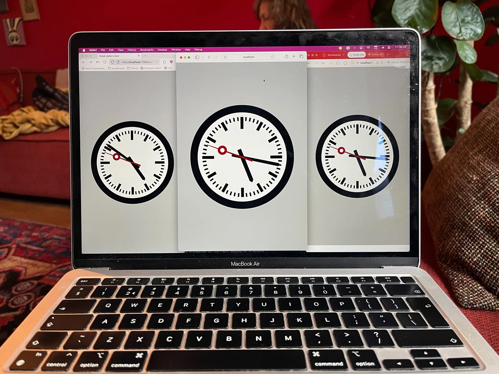 Three clocks on a laptop screen. They look like old station clocks, but they are clearly made with code. All three point at a different time, yet surprisingly all second hands point at 48 seconds. The clock on the left points at 9 minutes to 9. The one in the middle at 17 past 5, and the one on the right point at 16 past 5. If you look closely at the top right corner of the laptop screen you can see the time on the computer is 17:36 and, surprisingly, 46 seconds! 
