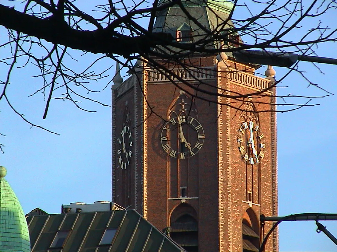 The three visible clocks on this hexagonal church tower all point at two minutes to five.