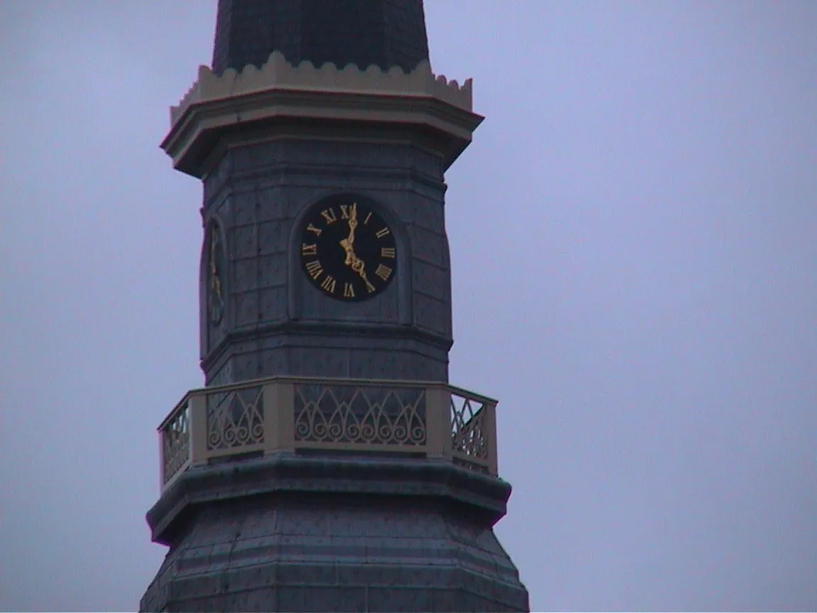 The clock on this church says it is two minutes past five.