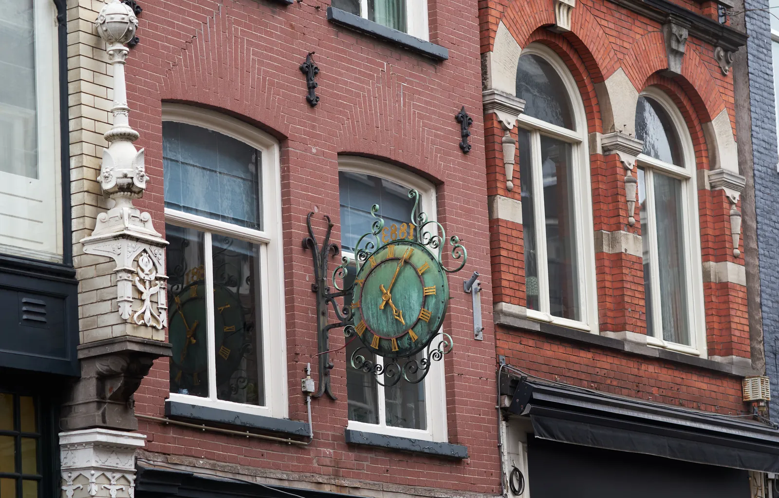 According to this old clock (it says 1883 and it looks bronze) in an old shopping street in Amsterdam it is 4 minutes past 5.
