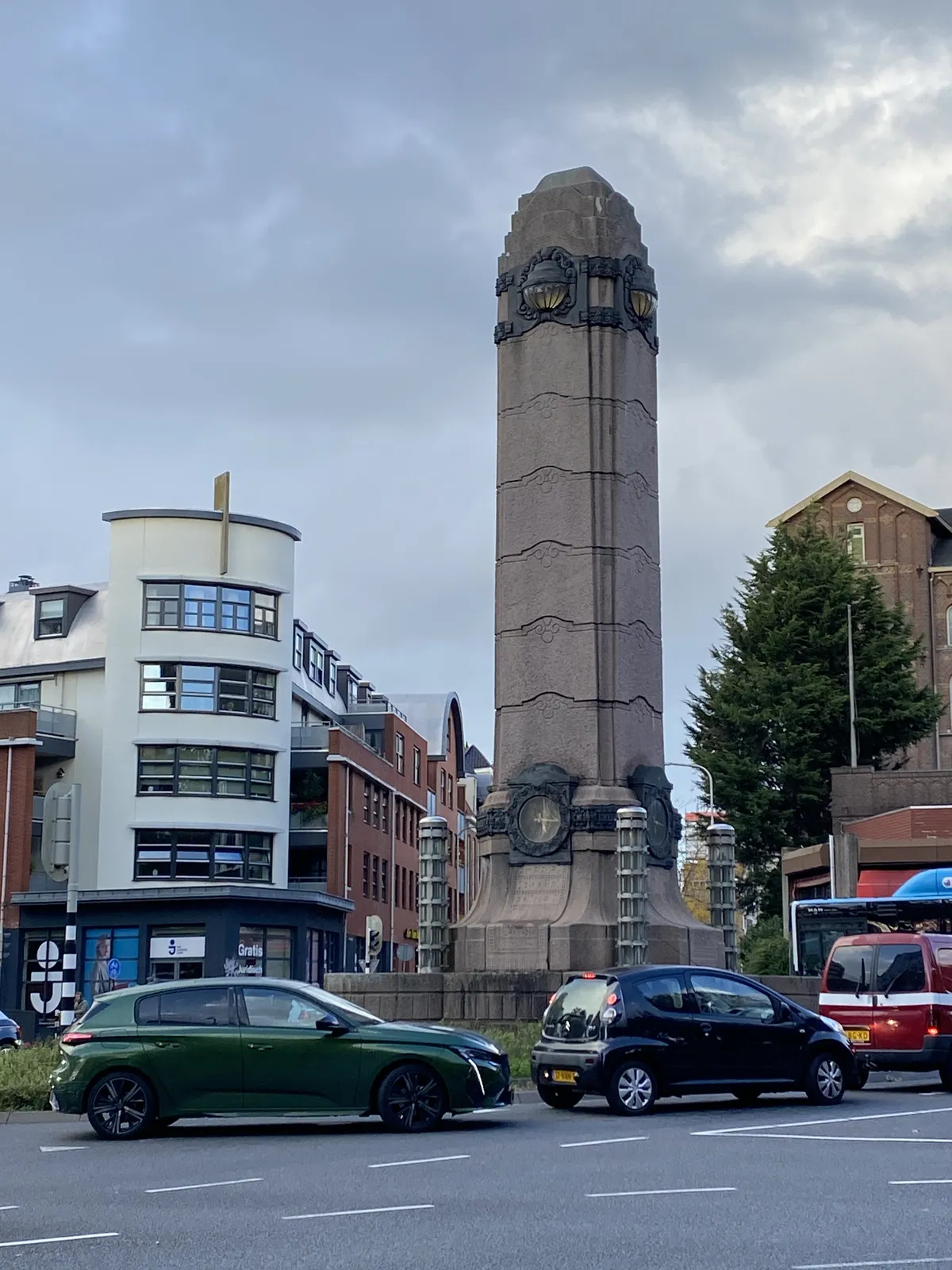 A large, phallic tower. Hidden in the tower, much lower that usual, is a clock. It points at 16 minutes past 5.