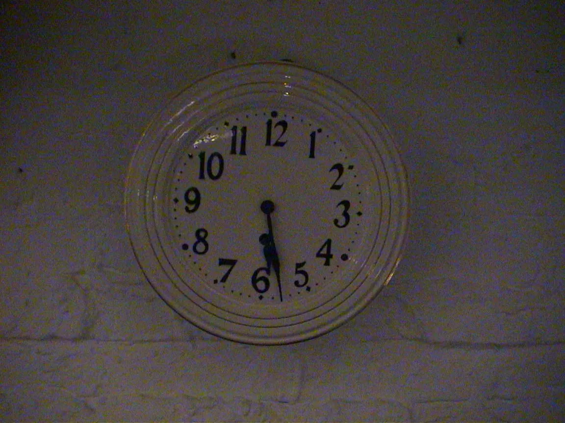 This clock points at 28 past five.