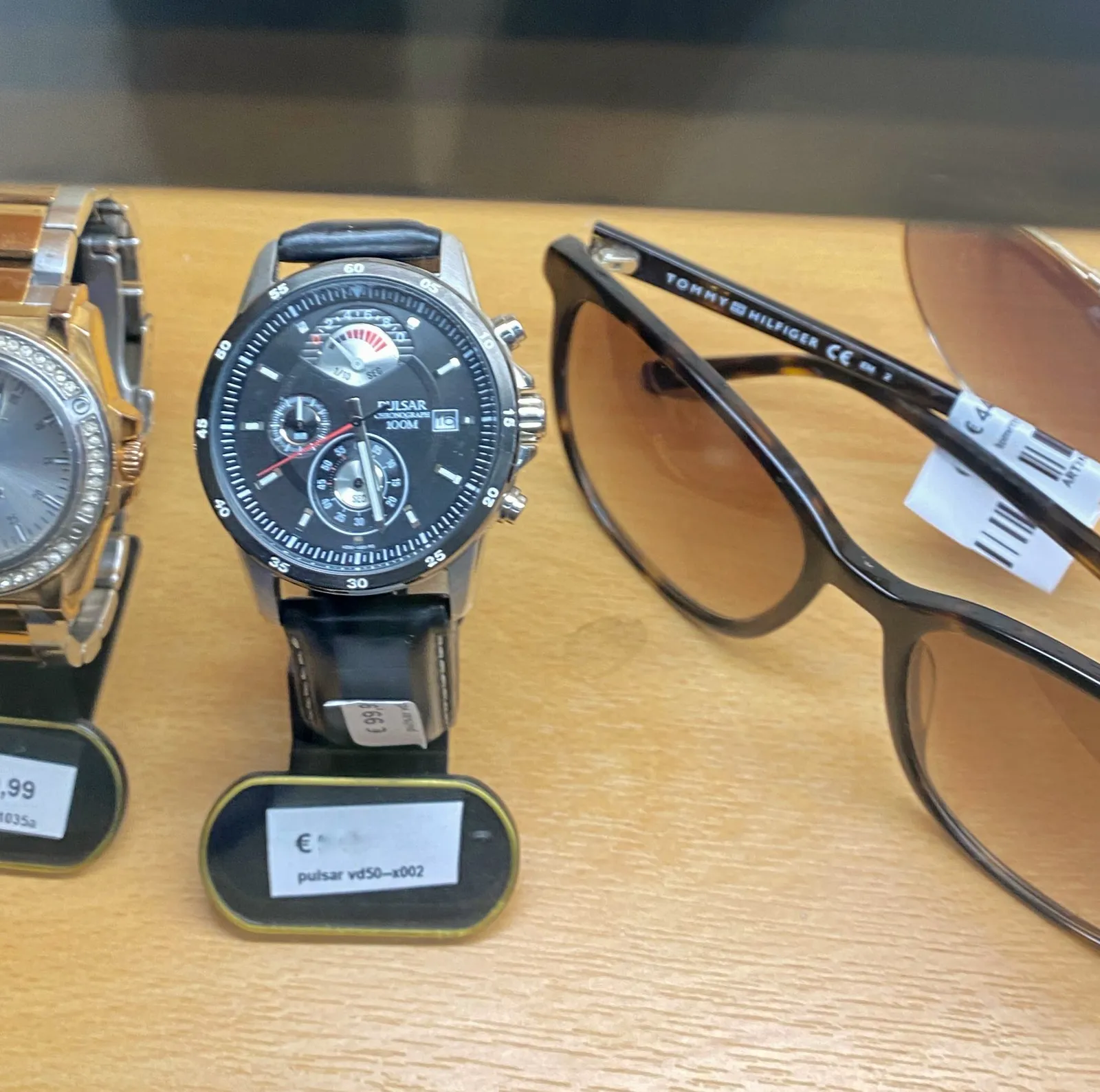 A wrist watch with more features than just showing the time. It says Pulsar Chronograph 100m on its face and it points at 28 minutes past 5.