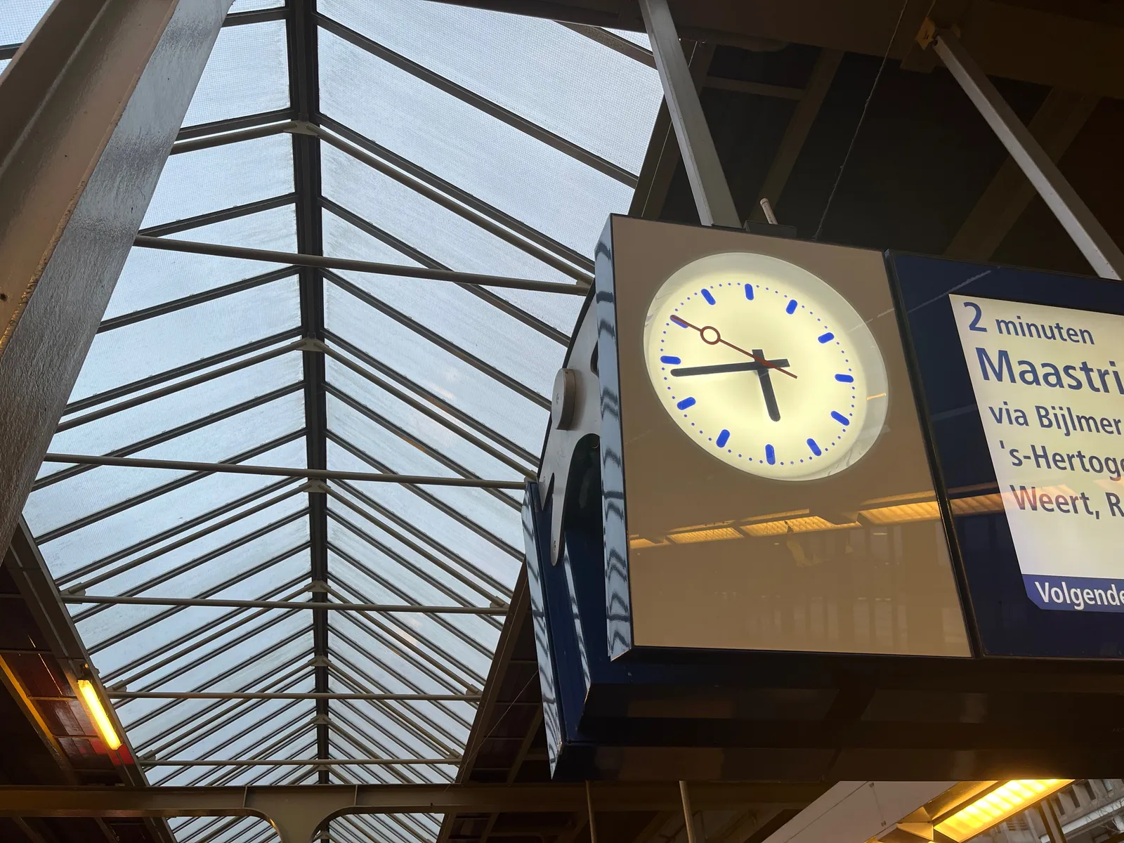 This clock on a train platform points at 5:43.