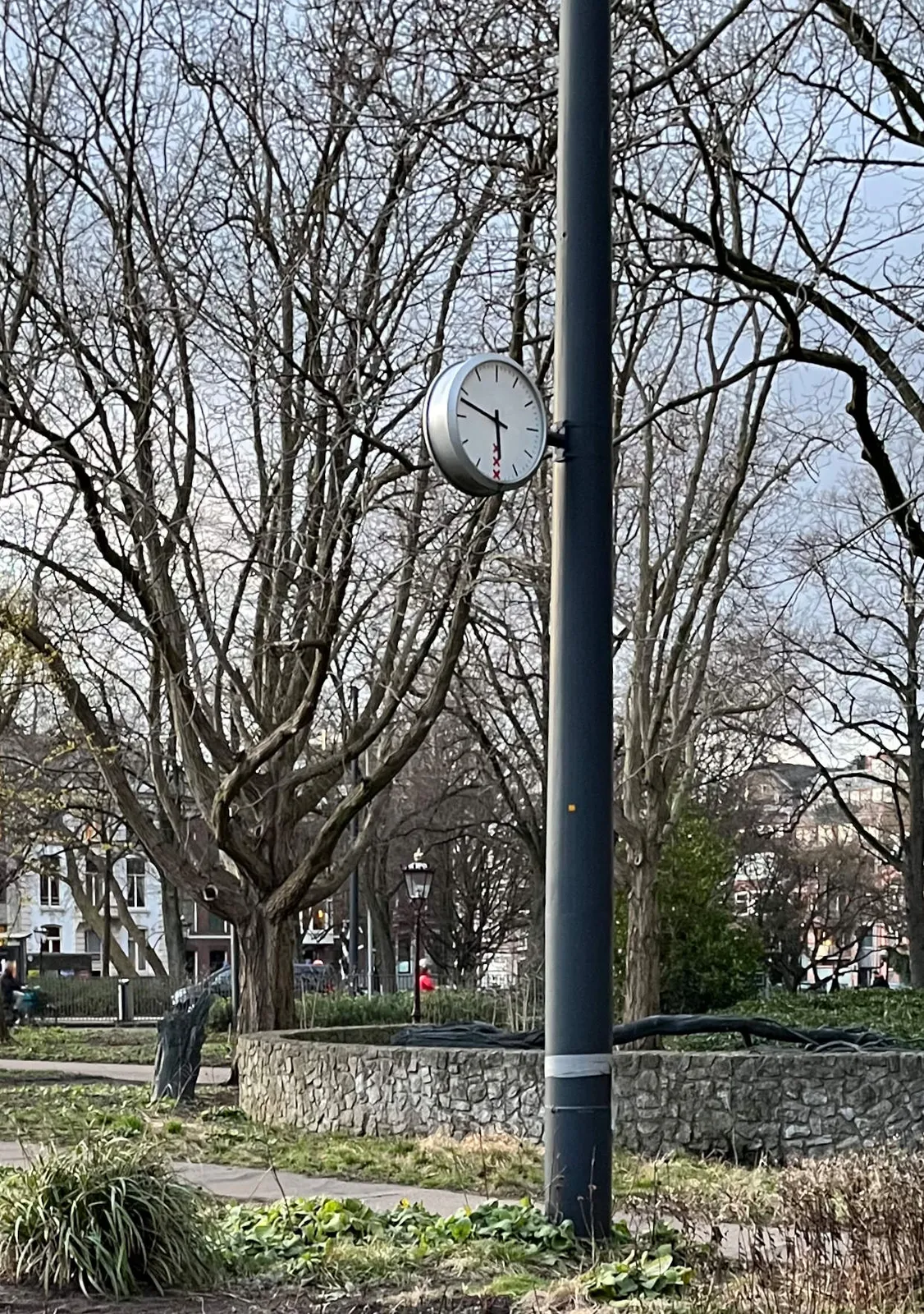 On this clock, attached to a pole, it is 5:48