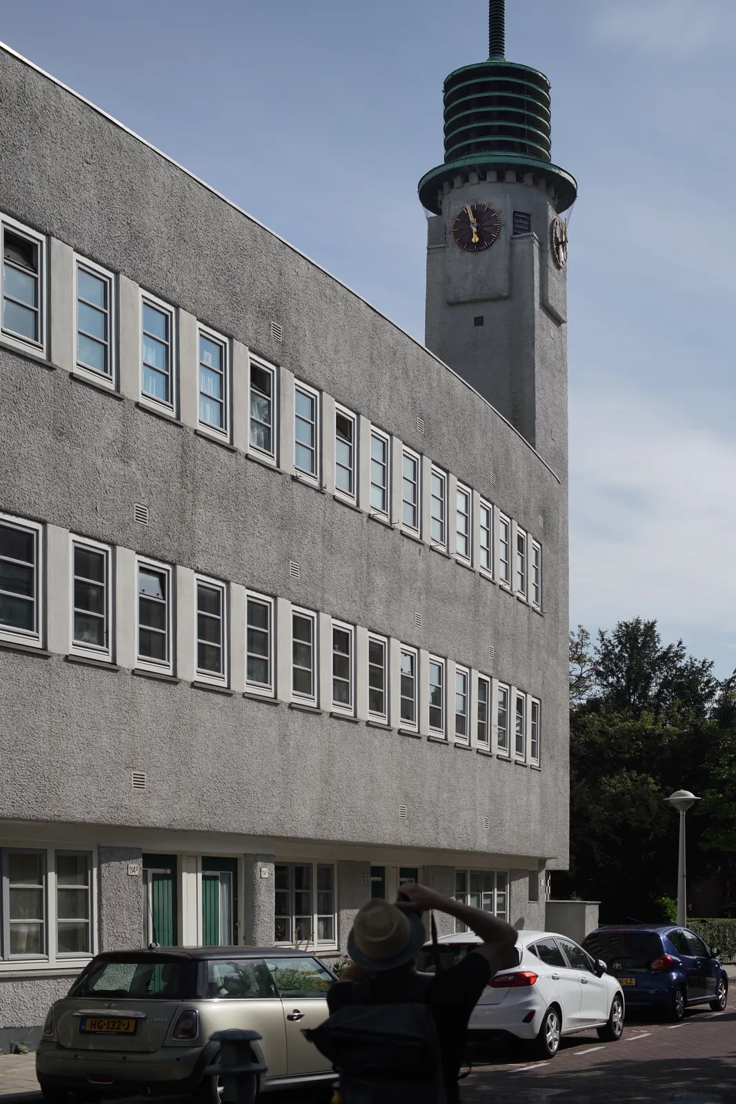On an building in Betondorp in Amsterdam there’s a tower with clocks. The one that’s clearly visible points at 3 minutes to six. 