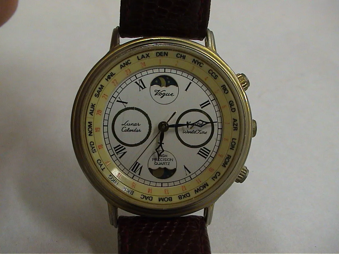 This watch with what looks like many clever options, points at thirteen, almost fourteen minutes past six. 