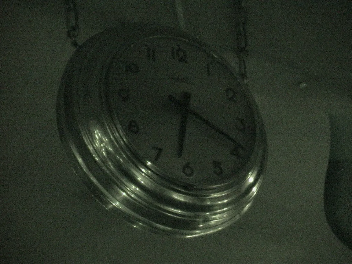This clock points at eighteen past six.