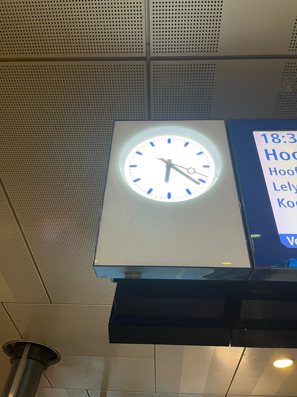 On this clock on a Dutch railway station it’s 21 past 6. 