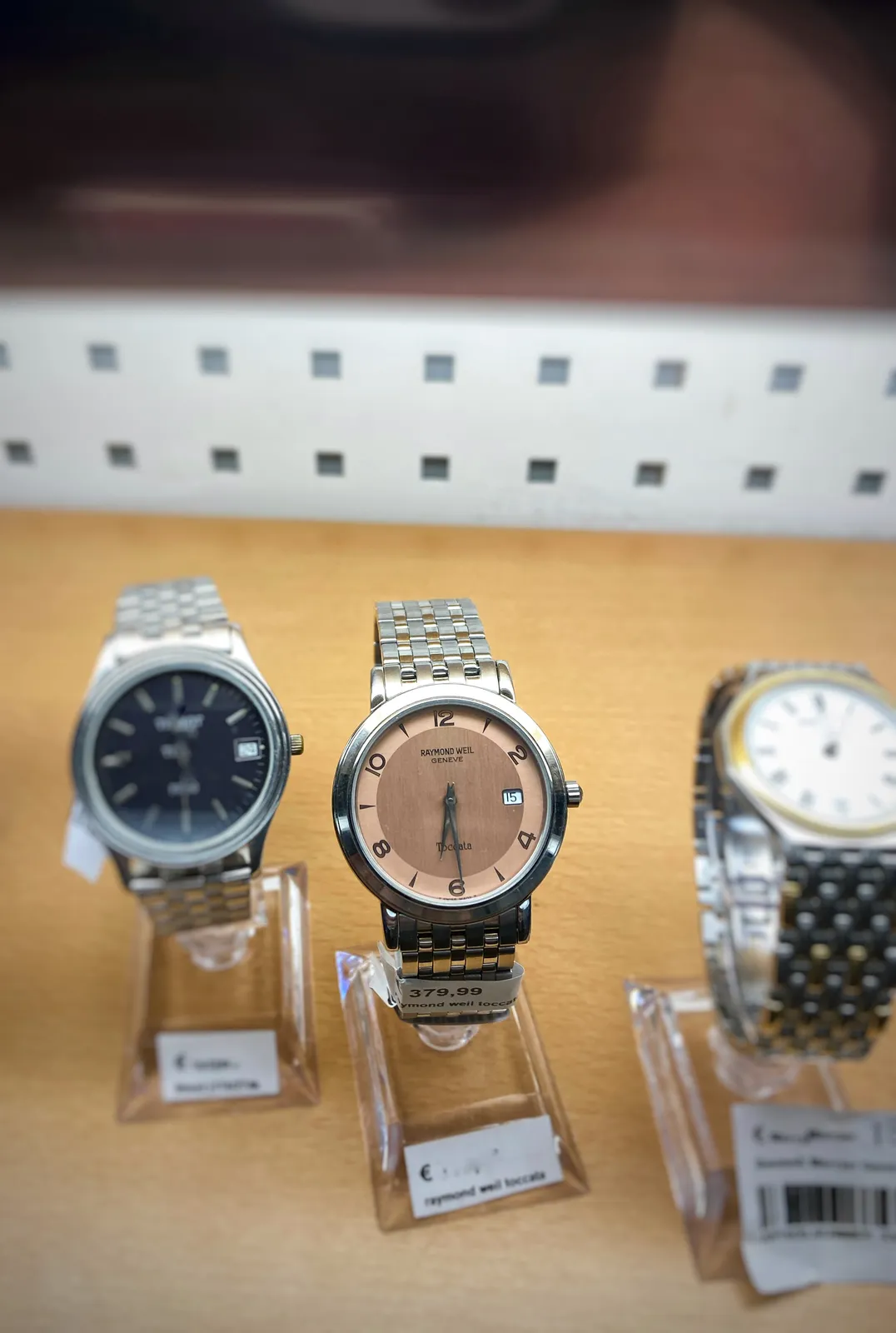 Three watches. The one that’s in focus points at 29 minutes past 6.