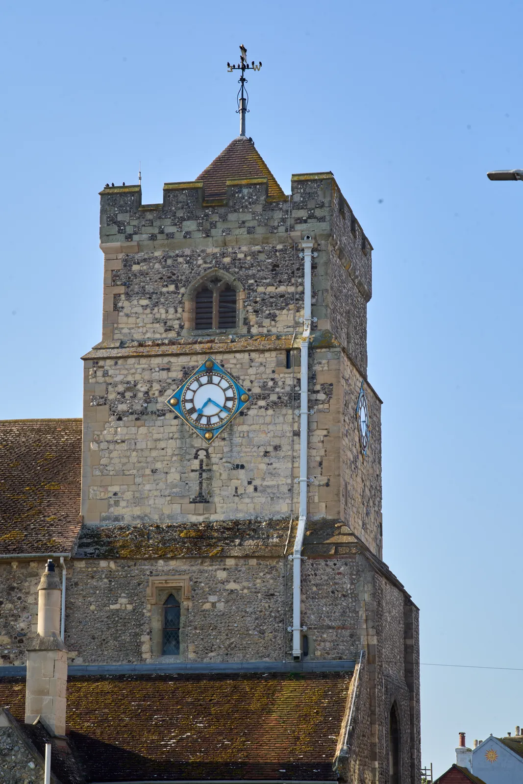 A castle-like church tower with a clock on it. It points at 21 minutes past seven.