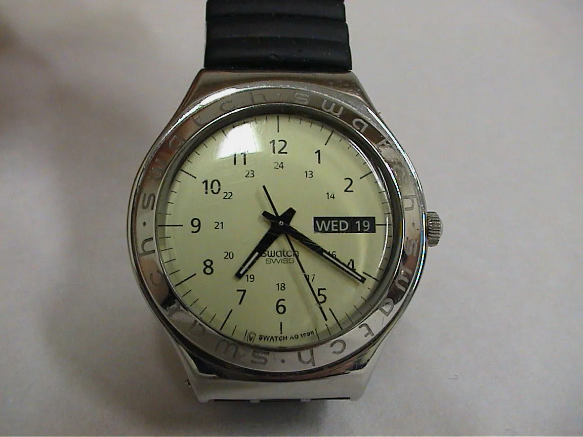 This watch points at twenty one past seven.