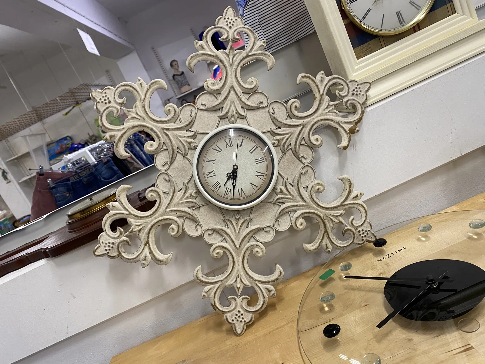 On this clock with quite some frills it is 07:33