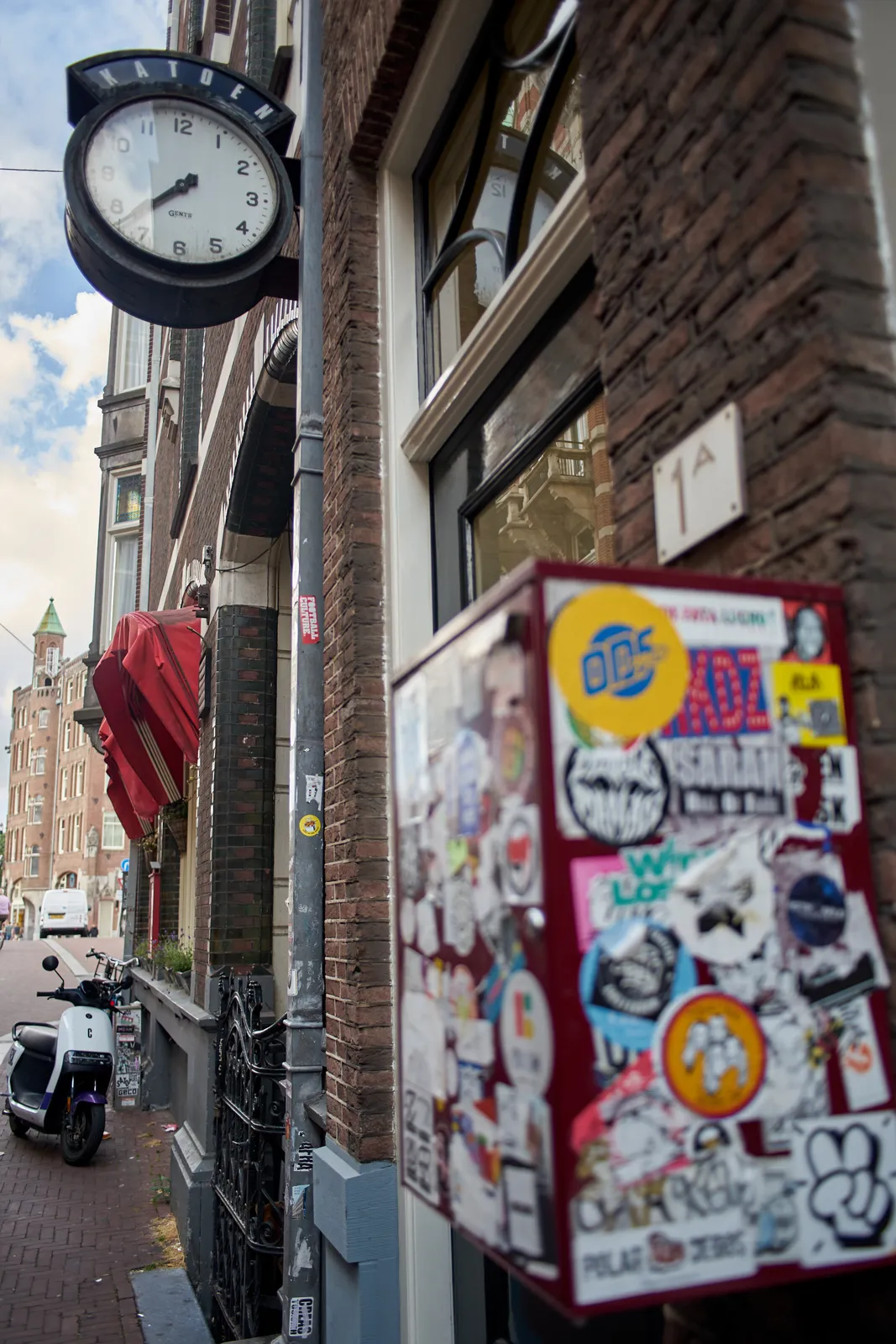 Attached to a facade in the centre of Amsterdam there’s a clock. It points at 22 minutes to eight.