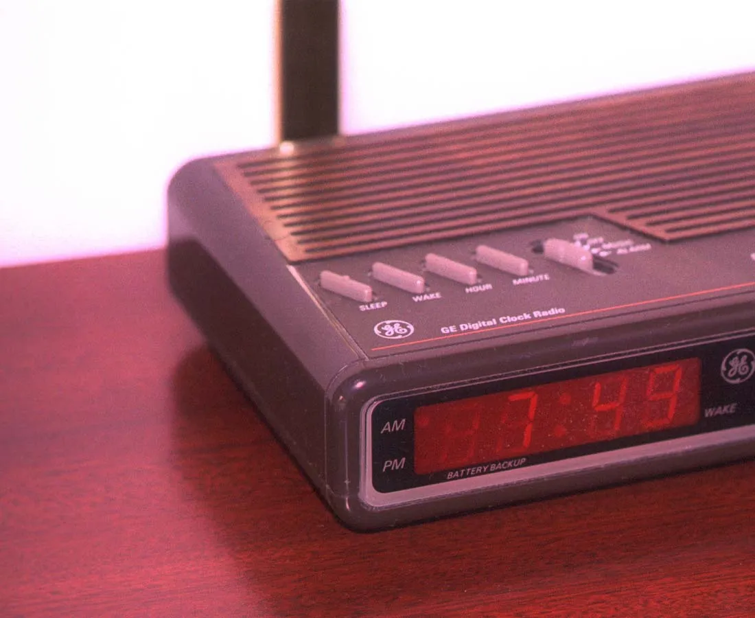 The clock radio says it is 7:49 AM.