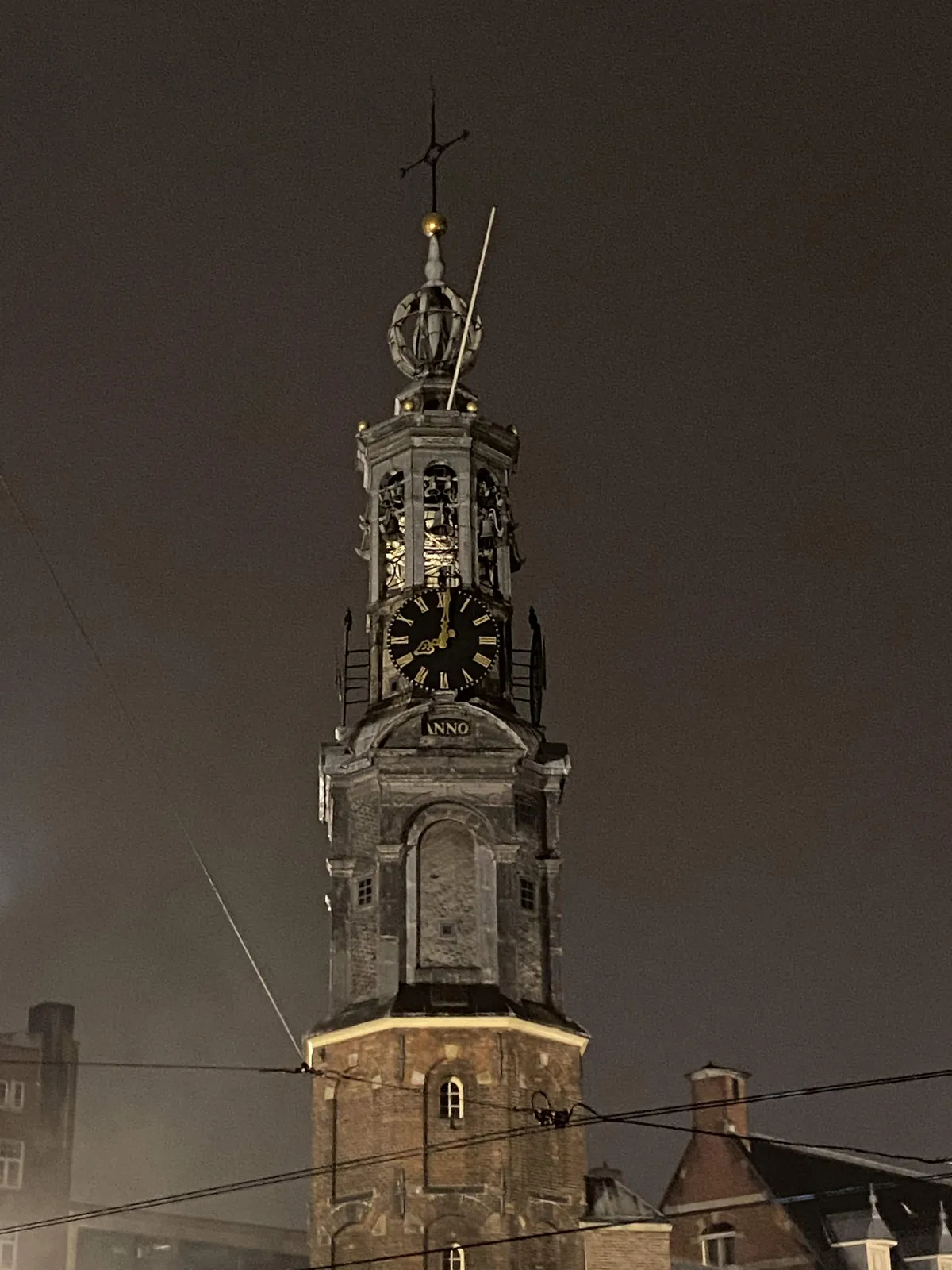 The clock on an old church points at 1 minutes past 8.