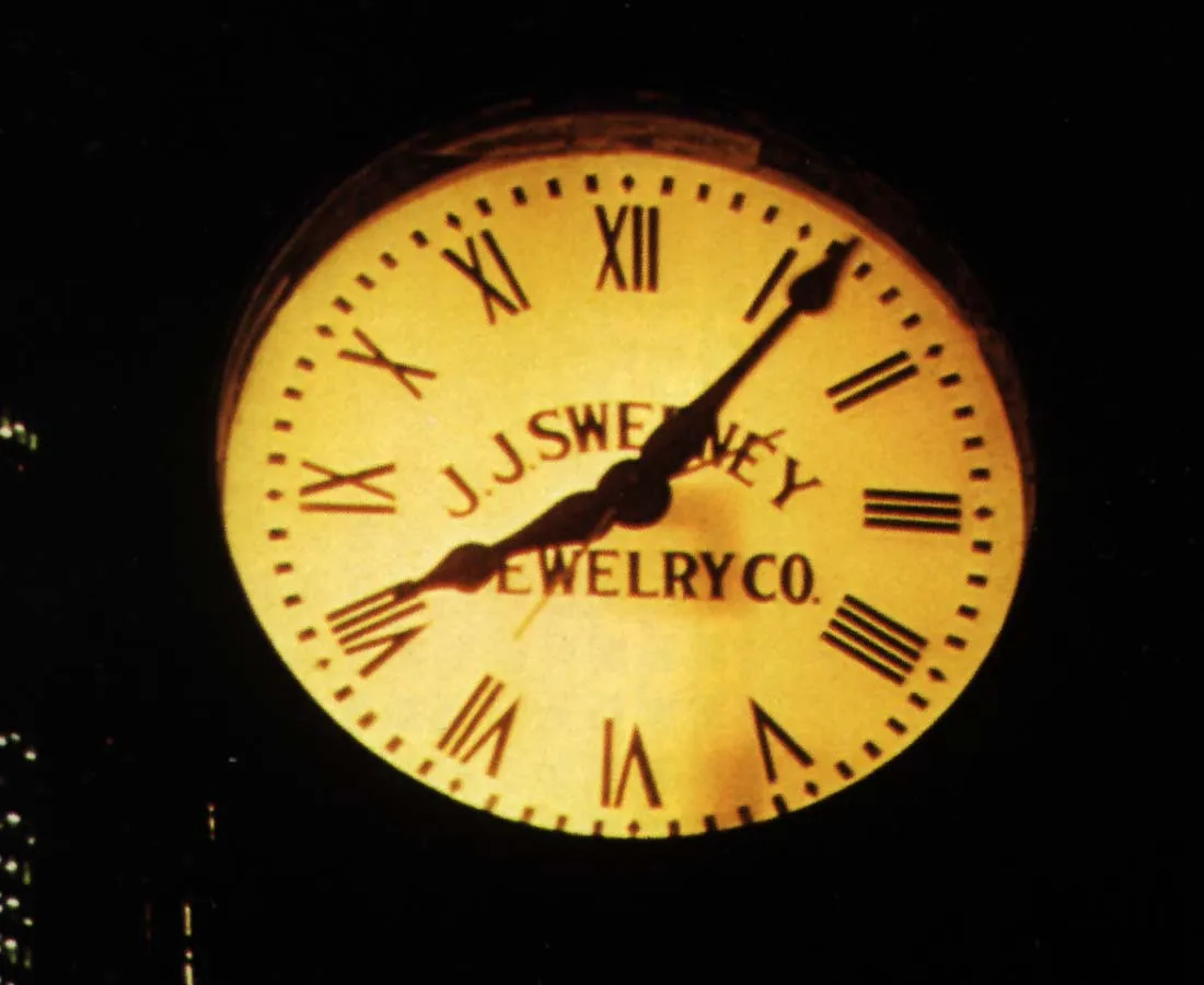 It’s dark, but there’s a light inside this large clock. It points at six past eight.