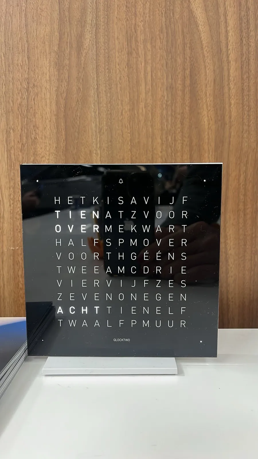 A ingenious clock. It’s a square plate, with words on it. By lighting up different words, different timestamps are spelled. Right now, the Dutch word for ten, the word for past, and the word for eight are lit. So indeed, it is ten past eight.