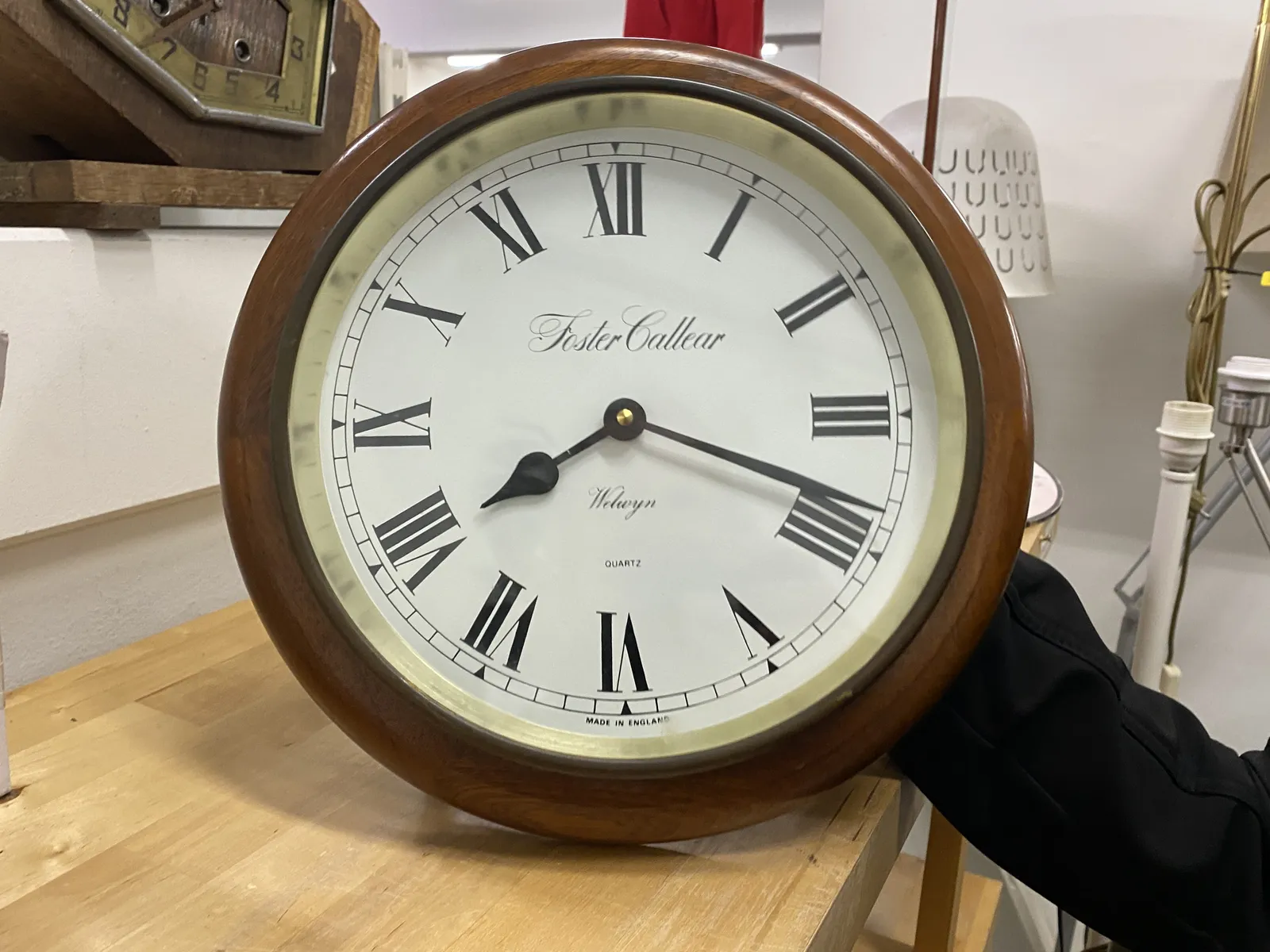 This wooden clock points at 18 past 8.