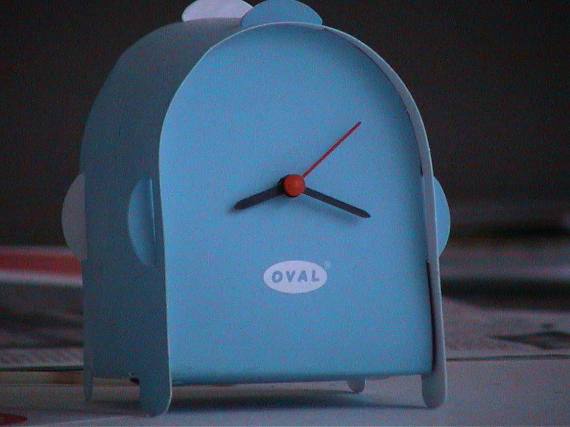 A clock that seems to like it’s been folded from one piece of paper, points at twenty past eight.